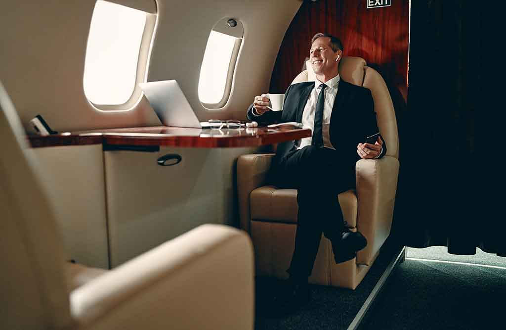 An executive relaxes aboard a private jet.